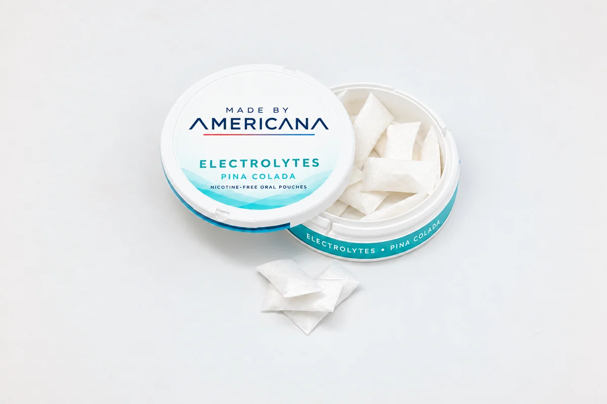 Open Made By Americana Pina Colada electrolyte oral pouch tin with individual white pouches